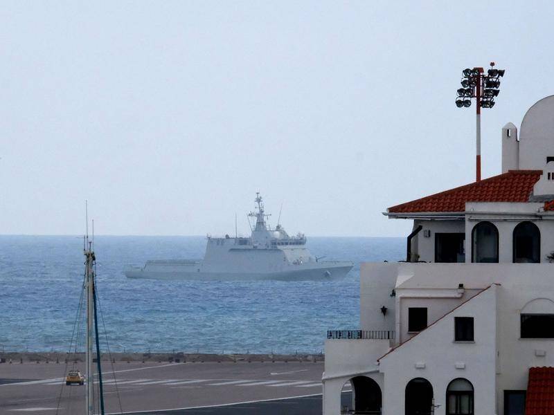 A Spanish warship has been accused of forcing ships to leave British waters near Gibraltar.