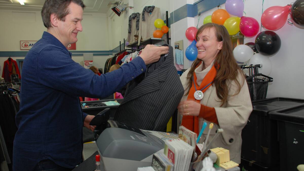 Do something good: Jon Dee shops at Anglicare Katoomba for some vintage store treasures during National Op Shop week which he founded in 2012. He bought his first suit in an op shop in the U.K. "It was a five quid suit for an interview which changed my life. Pictured with Stephanie Seers de Vasquez.