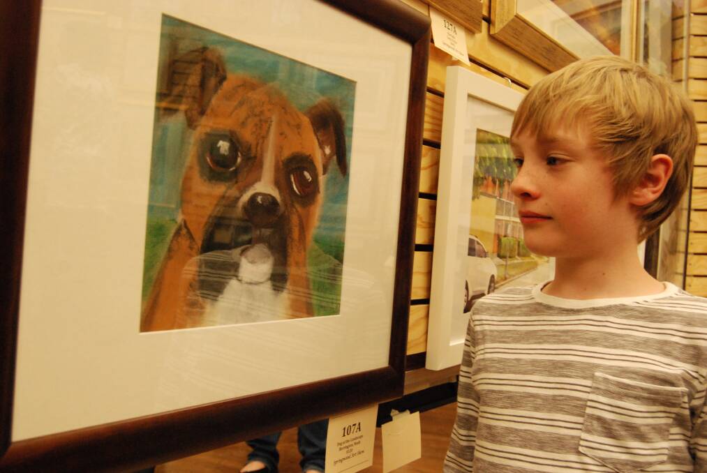 Top dog: Junior category winner, eight-year-old East Kurrajong resident Noah Berrington, facing his entry called Dog of the Landscape.