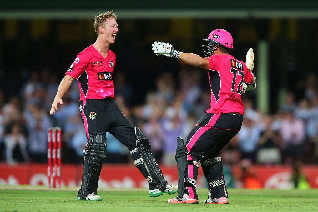 Sydney Sixers' Jordan Silk (left) celebrates with teammate Stephen O'Keefe after a boundary to claim victory for the Sixers against the Sydney Thunder at their Sydney Cricket Ground clash on January 22. The Sixers will play in Wednesday night's final against Perth in Canberra. Photo: Brendon Thorne/Getty Images.