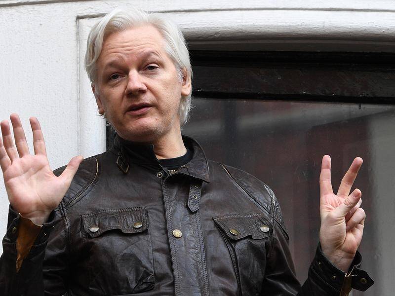 Julian Assange speaks to the media from the balcony of the Ecuadorian Embassy in London, May, 2017.