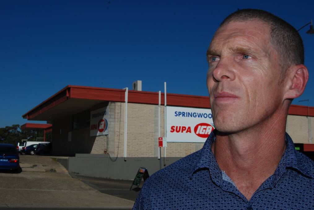 Rumour and innuendo surround talk of a large supermarket coming to Springwood. Pictured is Independent councillor Brendan Luchetti outside the Supa IGA. Clr Luchetti was elected on the Save our Springwood banner two terms ago. Photo: Shane Desiatnik