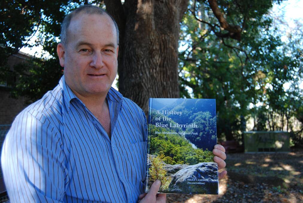 Bruce Cameron with the new second edition release of his book A History of the Blue Labyrinth: Blue Mountains National Park.