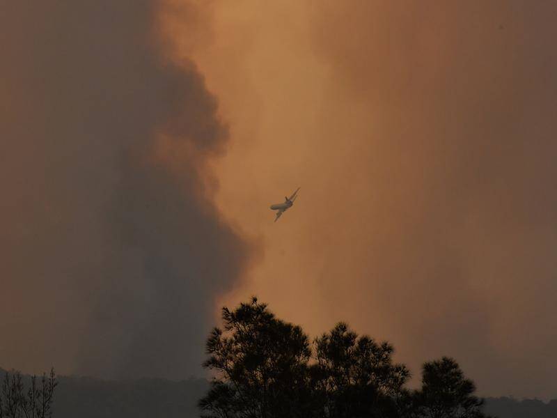 A fire has spread quickly north from the NSW-Victoria border when a southerly change swept through.