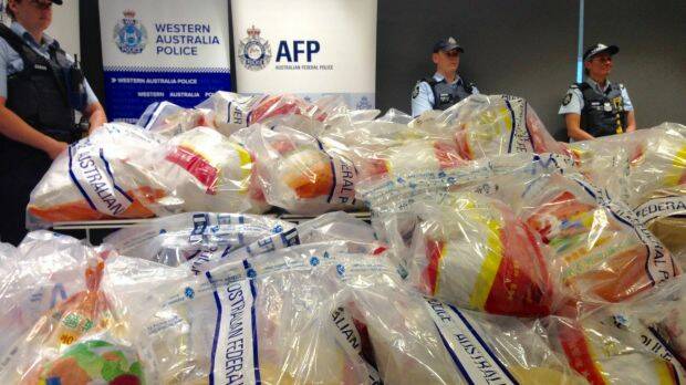 AFP and WA Police officers display the meth haul, worth more than $1 billion. Photo: Phil Hickey
