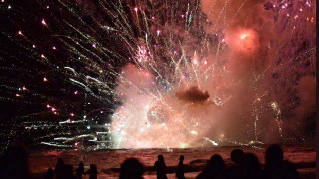 Crowds have been evacuated from Terrigal Beach, after a barge carrying fireworks caught alight during their 9pm show. Photo: Pip Cleaves/Twitter
