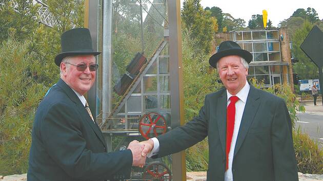 Clock-maker Raymond Saunders and former Scenic World managing director Philip Hammon with the new steam clock.