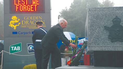 Blue Mountains City Council Councillor Don McGregor lays a wreath in Katoomba on behalf of the mayor, Mark Greenhill.