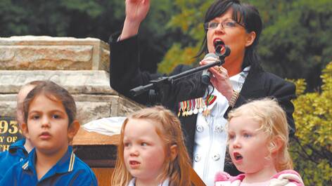 Hazelbrook public school students join in to sing Australia's national anthem at the  service at Gloria Park.