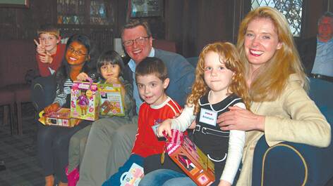Ian Harkin and Lucie Follett, creators of the Lottie Doll, with some of the children who would hope to feature in a mooted Lottie TV series or film.
