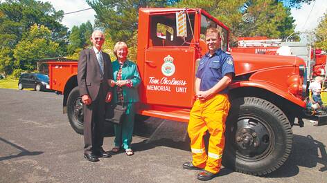 RFS life members Owen and Margaret Smith and Faulconbridge RFS captain Mark Roberts with the truck named after Margaret's father, Tom Chalmers. Photo: Andrew Mann