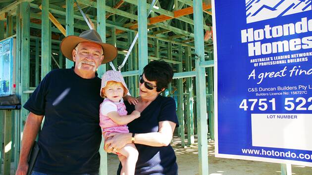 Dick and Therese Hurst with 18-month-old granddaughter Hannah Douglass are looking forward to moving into their new home in August after their home was destroyed during the October bushfires.