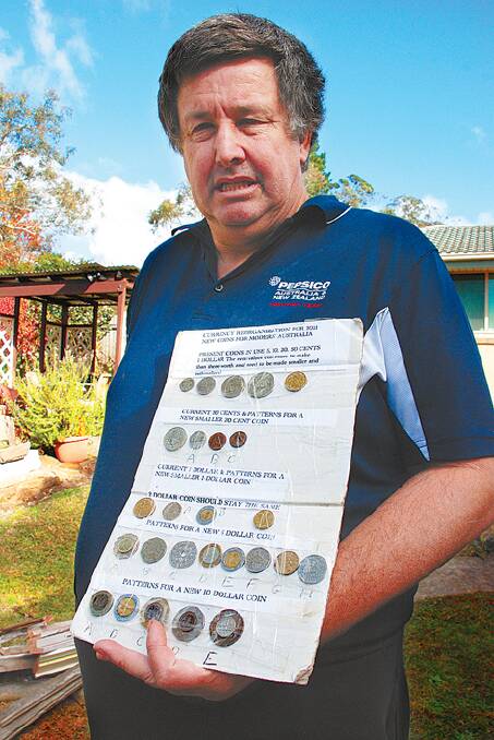"Their buying power is almost nothing," says Robert Ross of Australia's smallest coins. He is pictured with his coin board showing foreign currencies; many smaller, lighter coins with a higher face value than Australia's.