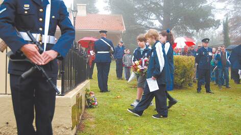 Students from Mt Victoria Public School lay a wreath on Anzac Day.