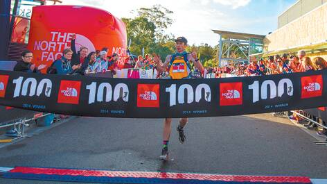 The North Face 100 winner Stu Gibson crosses the finish line. Photo: The North Face/Lyndon Marceau.