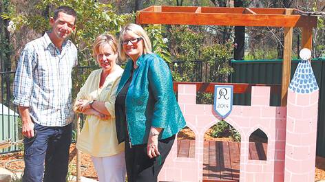 Matt Bradhurst, Habitat's NSW program manager, took MP Louise Markus to four properties in the Blue Mountains, including Rainbow Preschool (director Joan Murray pictured, centre) which have had new gardens and landscaping installed by the group's volunteers.