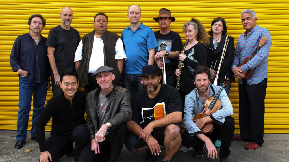 Lloyd Swanton (standing, fourth from left) with the musicians who will perform Ambon.