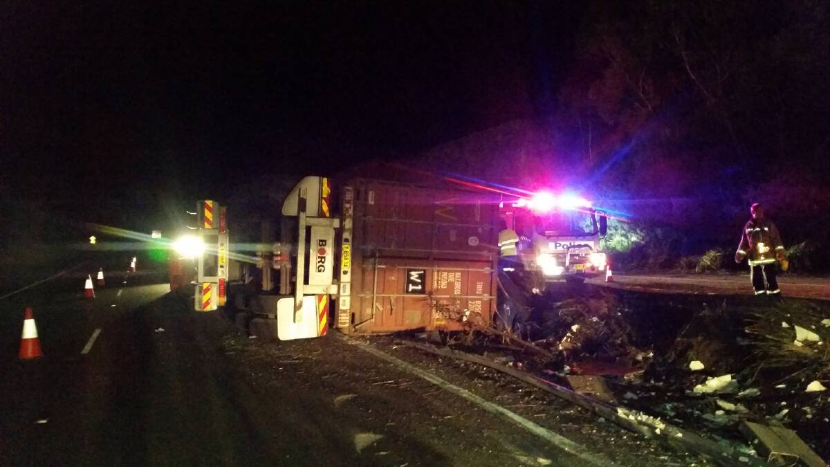 Police are investigating after a semi-trailer overturned at Woodford on Monday night. Photo: Top Notch Video.