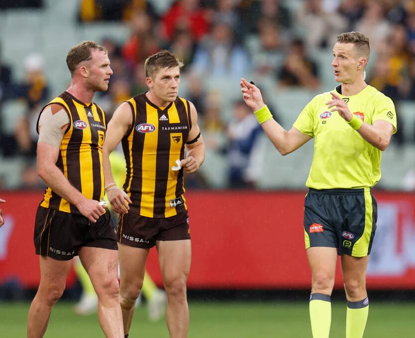 DISSENT: Tom Mitchell (left) was penalised for questioning an umpire's decision. Picture: Getty Images: Michael Willson/AFL Photos