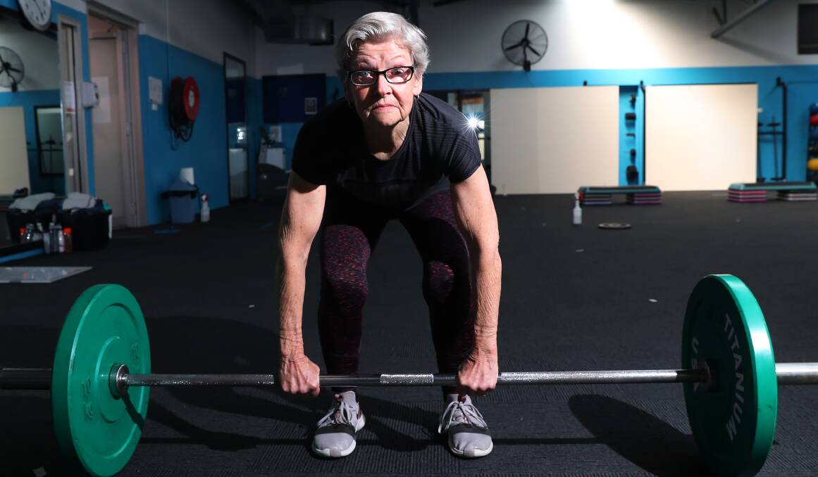 EYE ON PRIZE: Sue Hunter shows her strength as she deadlifts 50 kilograms and gives others in the class a run for their money. Picture: Emma Hillier
