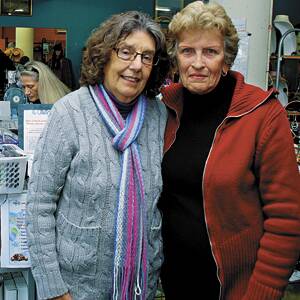 End of an era: Volunteers Ruth Smithers and Barbara Woolley in Springwood's Lifeline store last week. The store will close in July.