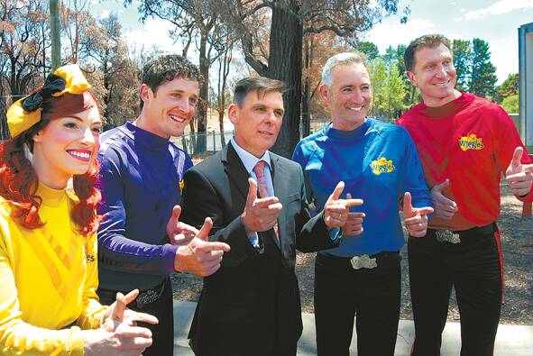 St Thomas Aquinas Primary School principal Serge Rosato fits right into The Wiggles line-up before their surprise lunchtime concert in the school hall last Wednesday.