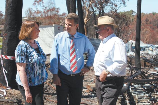 Blue Mountains MP Roza Sage with NSW finance minister Andrew Constance and bushfire recovery co-ordinator Phil Koperberg at Emma Parade on Tuesday morning.
