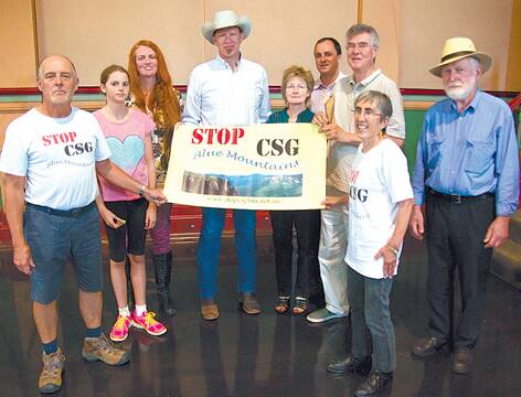 Behind the sign are John Fenton, Libby Blackburn (Stop CSG Blue Mtns) and Jeremy Buckingham MP with others from Stop CSG Blue Mountains.