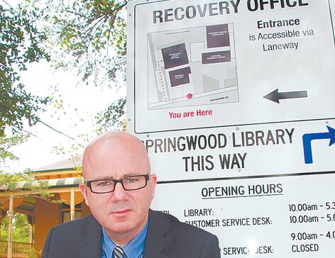 Mayor Mark Greenhill outside the Springwood Recovery Centre where, on Monday, he was still waiting for promised $1.8million in funding from the NSW government. "We've been stretched as far as we can go," he said.
