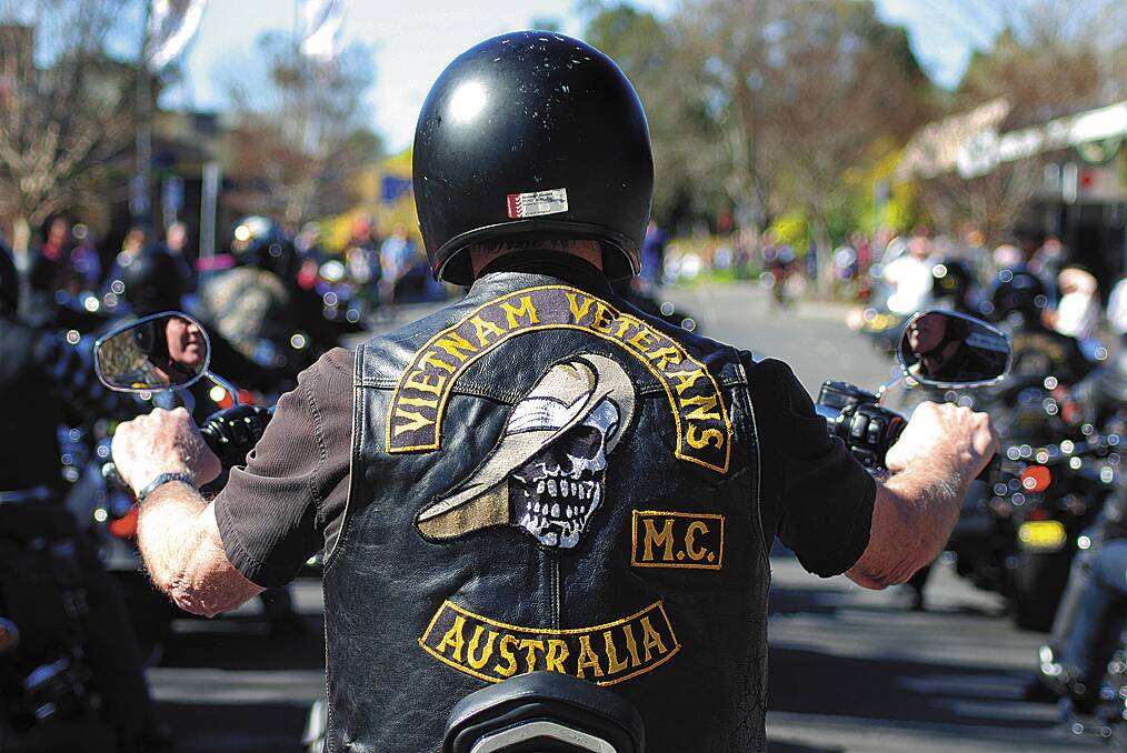  A Vietnam Veterans Australia Motorcycle Club member rides along Macquarie Road towards Springwood War Memorial on Sunday.