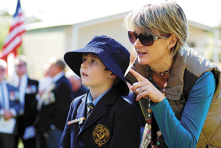 Blue Mountains Grammar Primary School (Valley Heights campus) student Max Klein and his mum Kate closely observe the service at Springwood War Memorial.
