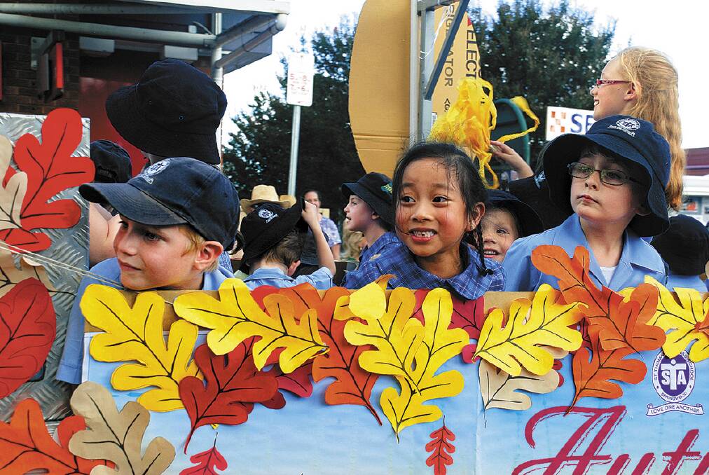  Students from St Thomas Aquinas Primary School look ahead as they make their way up Springwood’s Macquarie Road in the village’s Foundation Day parade on Saturday. 