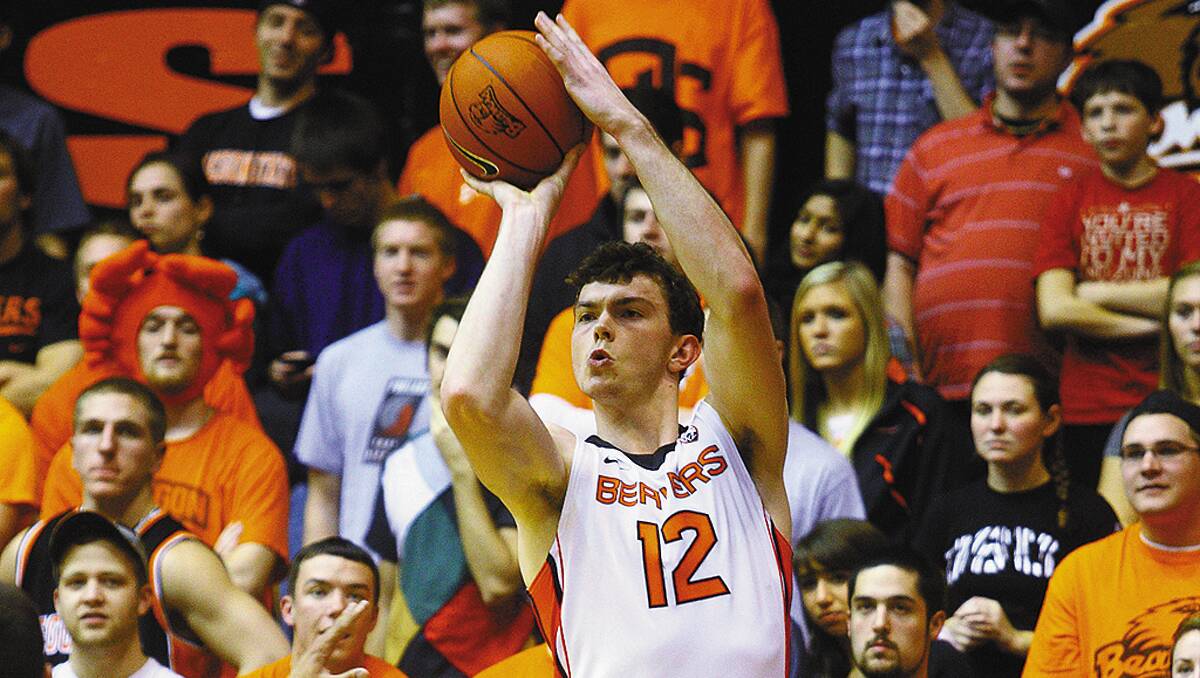 Angus Brandt attempts a three-point shot for Oregon State University in a US College basketball Pac-12 game earlier this year. The talented centre and former Springwood Scorchers junior was his team's leading point-scorer in an 11-day end-of-season European club tour last month. Photo: Oregon State University.